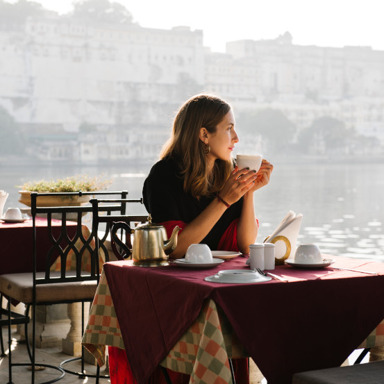 Western woman having a teatime at a cafe in Udaipur